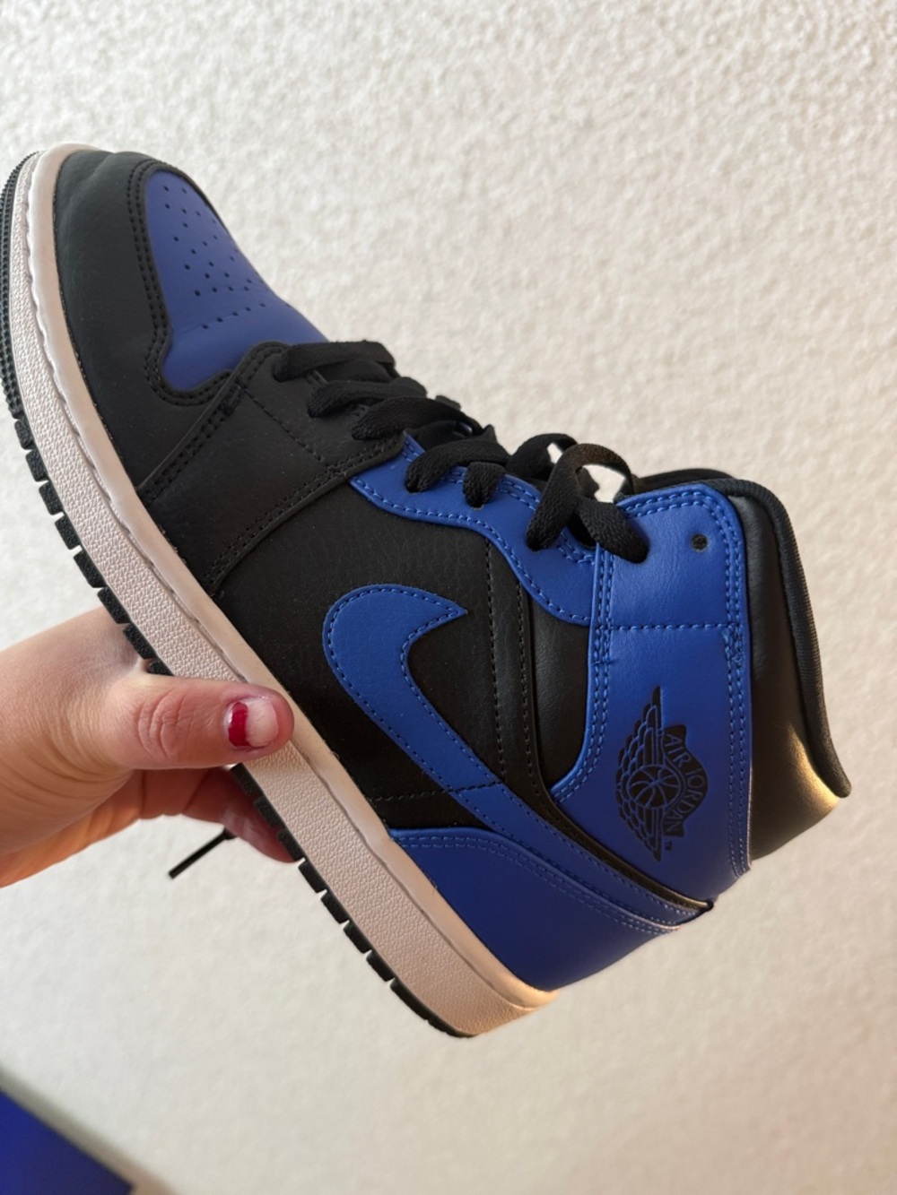 Air Jordan 1 Mid Black and Royal Blue Sneakers
